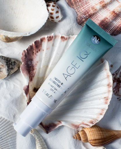 Neora’s Age IQ Invisi-Bloc Sunscreen Gel Broad Spectrum SPF 40 laying on a seashell